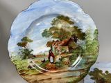 a plate with a picture of a man and a dog on it