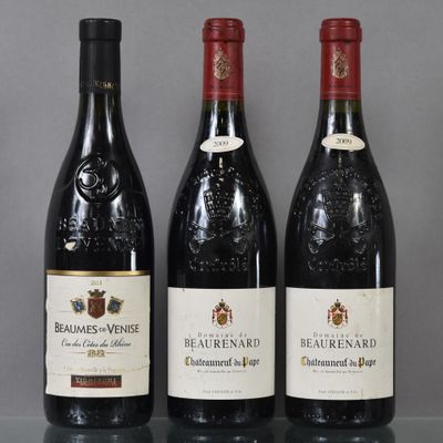three bottles of wine are lined up on a table