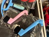 many different items in a plastic container on the floor