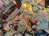 a pile of card game cards on a table