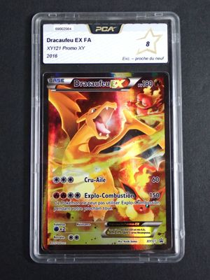 a close up of a pokemon card in a plastic case