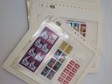 three envelopes with stamps are sitting on top of each other