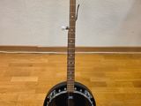 an image of a guitar on a stand on a hard wood floor