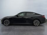 the bmw z4 is parked in a parking lot on a cloudy day