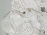 a pile of white clothing on a table