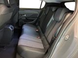 the back seats of a car with a luggage bag in the back