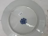a plate with a blue and white design on it