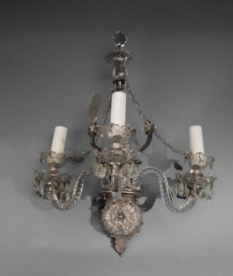 a chandelier that is hanging from the ceiling
