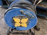 an image of a blue hose on a cart in a garage