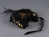 a black bag with gold and black feathers on it