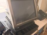 a laptop computer sitting on top of a desk next to a cell phone