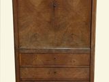 an image of a wooden cabinet with drawers and a marble top