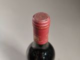 a bottle of wine that is sitting on a table