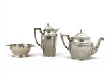 three pieces of silverware including a teapot, a bowl and a spoon