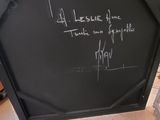 a blackboard with writing on it in a room