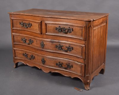 an old wooden chest of drawers with ornate carvings on the drawers