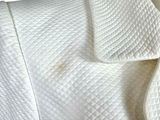 a close up of a white jacket on a mannequin mannequin