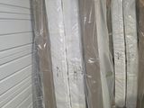many boxes of mattresses in a storage room