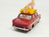 a red toy car with a sign on top of it