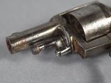 a small gun that is sitting on a table