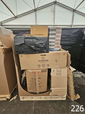 a pile of boxes and boxes sitting in a warehouse