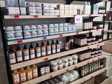 many bottles of skin care on the shelves in the store