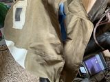 a bag that is sitting on top of a pile of wood
