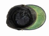 a black hat with a green brimle sitting on top of it