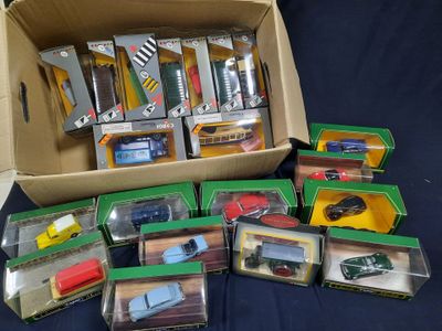 a box full of assorted toy cars on a table