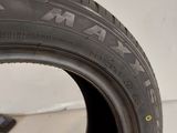 a close up of a tire on a white surface