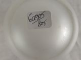 a close up of a glass ball with a sticker on it