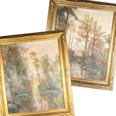 deux tableaux encadrés représentant des arbres et une rivière dans un cadre doré