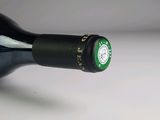 a bottle of wine that is sitting on a table