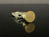 a close up of a ring on a table with a black background