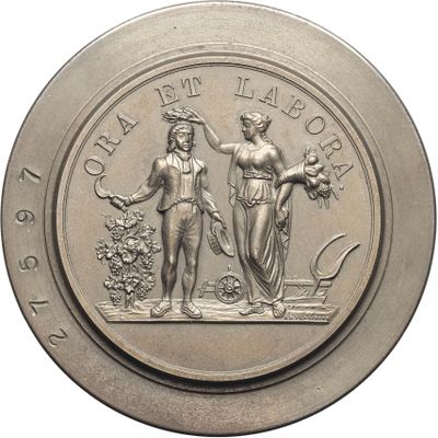 the coin is silver with a picture of two women holding flowers