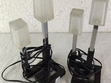 three lamps that are on top of a table