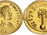a gold coin with an image of a man on it