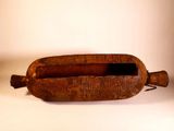 a small wooden object that is sitting on a table