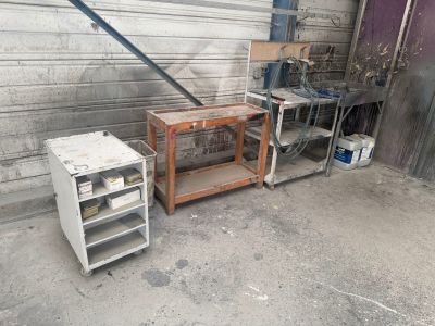 a small table and a small refrigerator in a garage