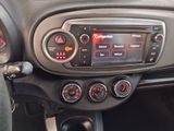 a car dashboard with a radio and a steering wheel