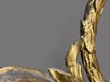 a gold leaf decoration on the wall of a room