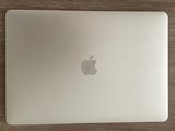 an apple macbook pro laptop sitting on top of a wooden table