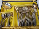 a yellow box with a set of silverware in it