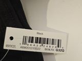 a label on the back of a pair of black shoes
