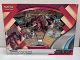 La boîte est ouverte pour montrer le contenu du jeu de cartes à collectionner Pokémon.