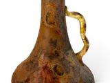 a vase with a handle that has a snake on it