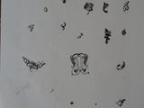 a piece of paper with drawings on it on a table