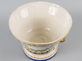an image of a white bowl with blue and green designs on it