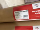 two rolls of paper sitting on top of a cardboard box