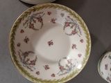 a small cup and saucer sitting on a table